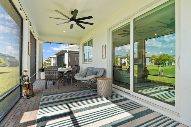 14175 SW Harker St, Port Saint Lucie, FL 34987 - sunroom / solarium with a ceiling fan and outdoor dining space