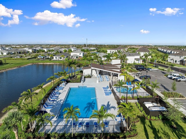 14175 SW Harker St, Port Saint Lucie, FL 34987 - aerial perspective of suburban area featuring a large body of water and a pool