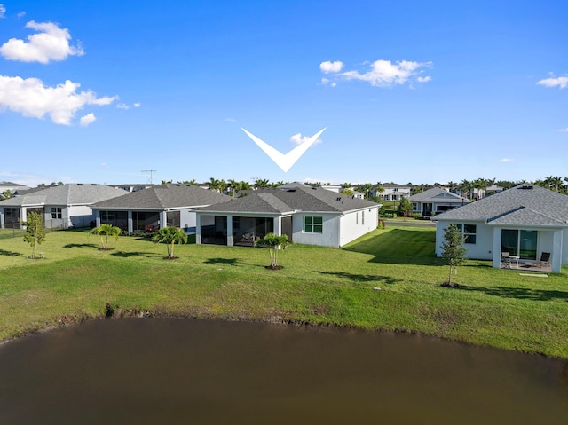 14175 SW Harker St, Port Saint Lucie, FL 34987 - view of front facade with a front lawn, a residential view, a water view, and a sunroom