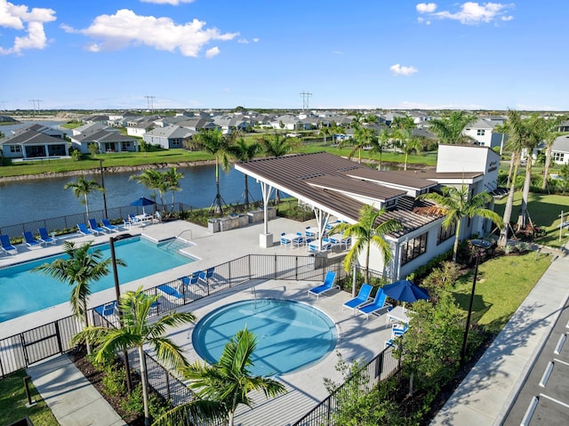 14175 SW Harker St, Port Saint Lucie, FL 34987 - community pool with a residential view, a patio, a water view, and a hot tub