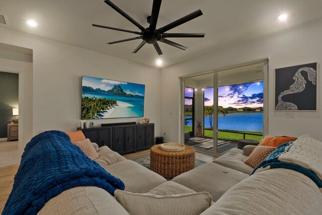 14175 SW Harker St, Port Saint Lucie, FL 34987 - living room with light wood finished floors, a ceiling fan, and recessed lighting