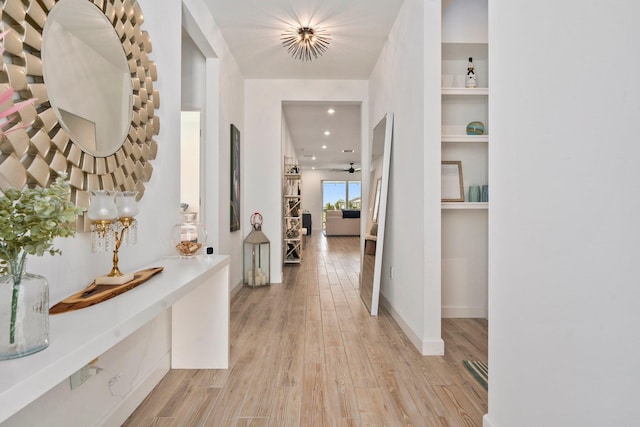 14175 SW Harker St, Port Saint Lucie, FL 34987 - hallway featuring light wood finished floors, recessed lighting, and baseboards