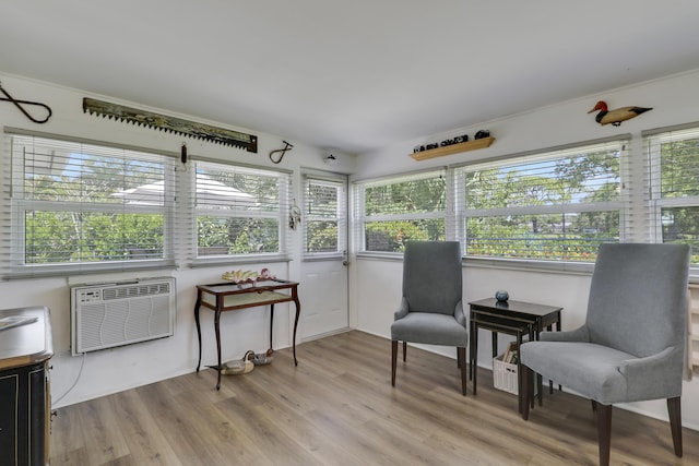 18315 SE Courtview Cir, Tequesta, FL 33469 - sunroom with a wall unit AC, wood finished floors, and a wealth of natural light