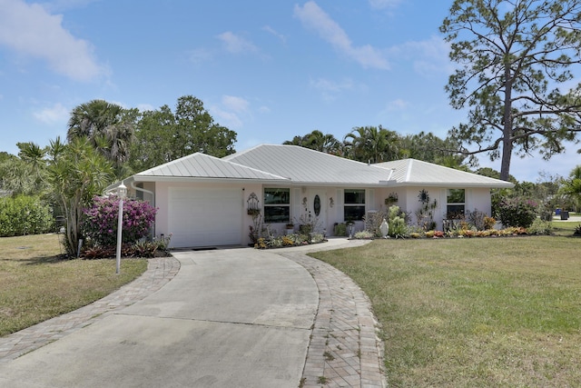 18315 SE Courtview Cir, Tequesta, FL 33469 - single story home featuring driveway, metal roof, a front yard, an attached garage, and stucco siding