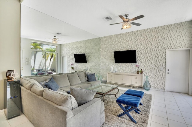 living room with visible vents, a ceiling fan, and tile patterned floors