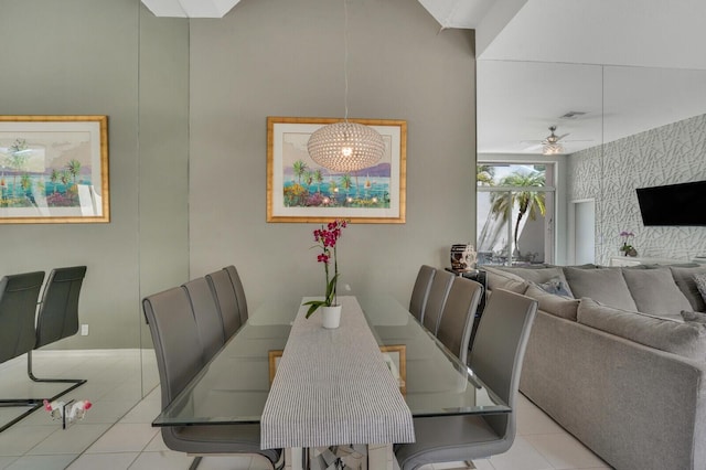 tiled dining room featuring ceiling fan and visible vents