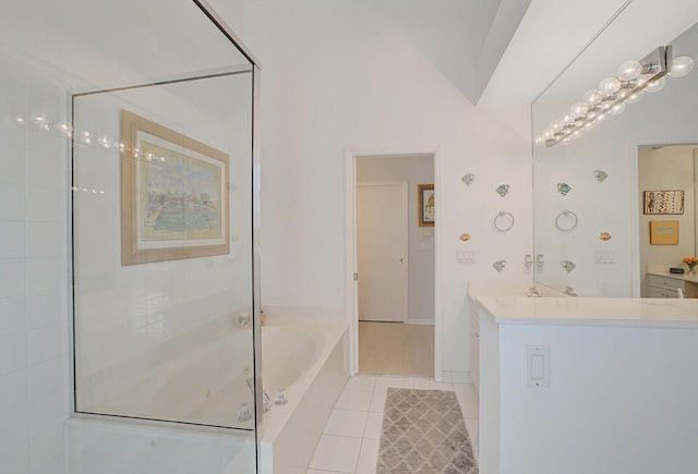 bathroom with vanity, a shower with door, lofted ceiling, tile patterned floors, and a bath