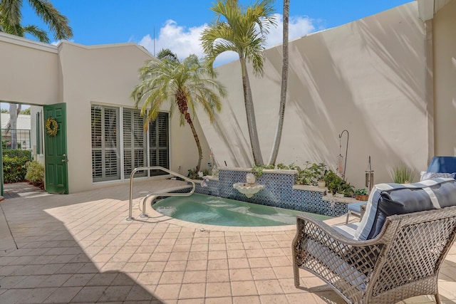 view of pool featuring a patio