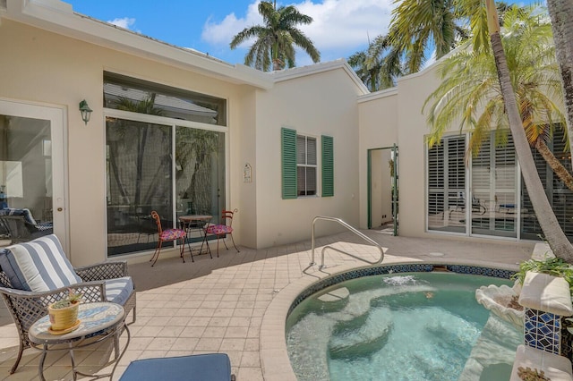 view of swimming pool with a patio and a jacuzzi