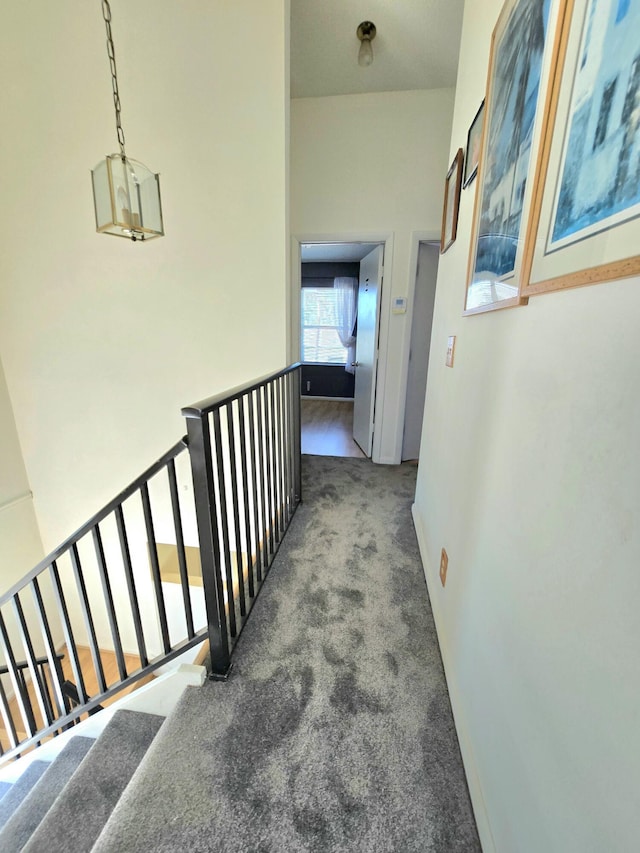 corridor with carpet flooring