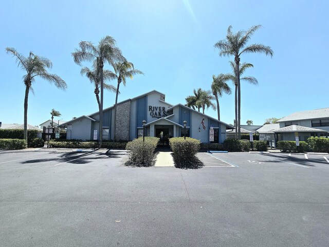 view of property featuring uncovered parking
