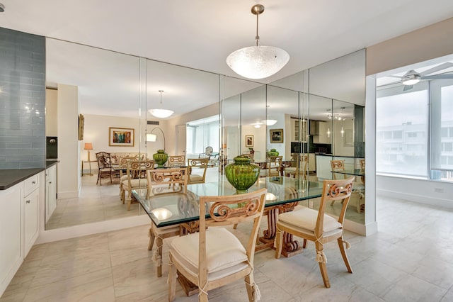 44 Cocoanut Row Unit 507A, Palm Beach, FL 33480 - dining area with healthy amount of natural light, a ceiling fan, and baseboards