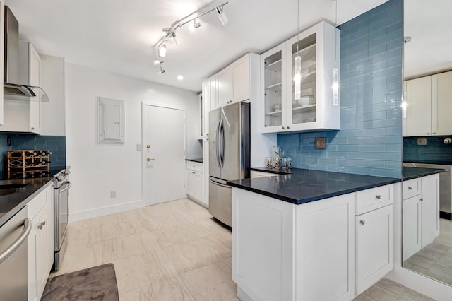 44 Cocoanut Row Unit 507A, Palm Beach, FL 33480 - kitchen with stainless steel appliances, dark countertops, glass insert cabinets, and backsplash