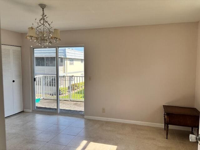 unfurnished dining area with light tile patterned flooring, baseboards, and a notable chandelier