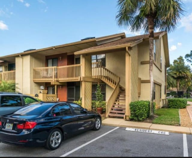13135 Chadwick Ct Unit 7, Wellington, FL 33414 - view of building exterior with uncovered parking and stairs