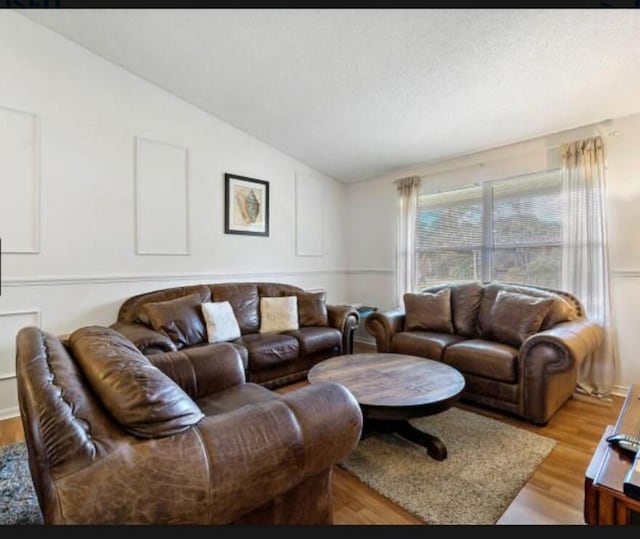 13135 Chadwick Ct Unit 7, Wellington, FL 33414 - living area featuring light wood-style flooring and lofted ceiling