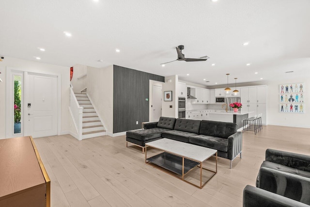 9610 Sterling Shores St, Delray Beach, FL 33446 - living area with stairs, a ceiling fan, light wood-type flooring, recessed lighting, and baseboards