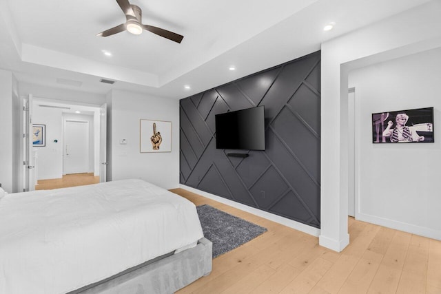 9610 Sterling Shores St, Delray Beach, FL 33446 - bedroom with light wood-style floors, baseboards, recessed lighting, a ceiling fan, and a tray ceiling