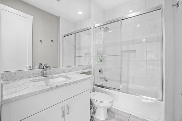 9610 Sterling Shores St, Delray Beach, FL 33446 - full bath featuring vanity, toilet, combined bath / shower with glass door, and recessed lighting