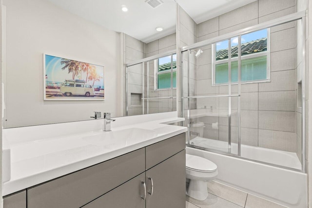 9610 Sterling Shores St, Delray Beach, FL 33446 - bathroom with vanity, toilet, bath / shower combo with glass door, tile patterned flooring, and recessed lighting
