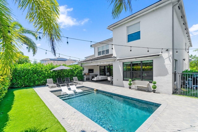 9610 Sterling Shores St, Delray Beach, FL 33446 - rear view of property featuring an outdoor hangout area, a patio, and stucco siding