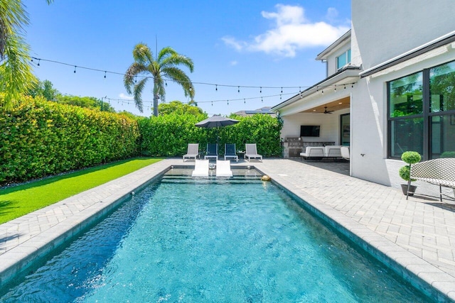 9610 Sterling Shores St, Delray Beach, FL 33446 - view of swimming pool featuring a patio area, a ceiling fan, and area for grilling