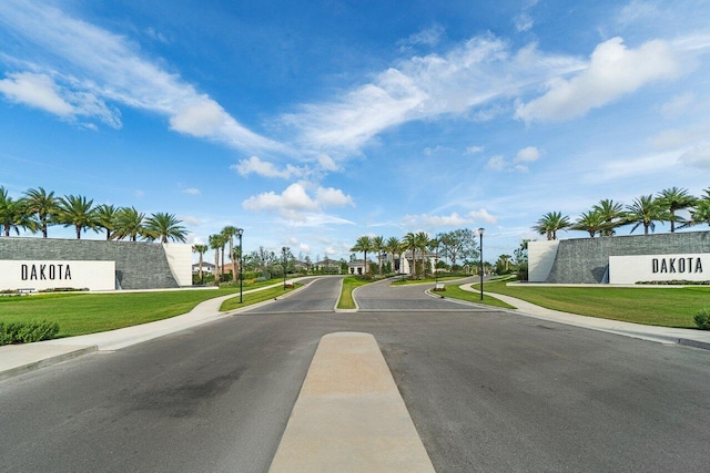 9610 Sterling Shores St, Delray Beach, FL 33446 - view of asphalt road featuring sidewalks, street lighting, and curbs