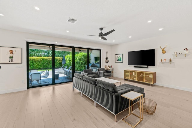 9610 Sterling Shores St, Delray Beach, FL 33446 - living area featuring a ceiling fan, wood finished floors, baseboards, recessed lighting, and a textured ceiling