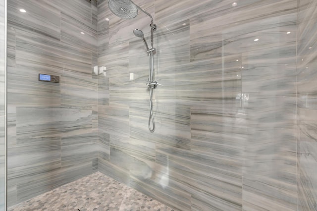 full bath with a marble finish shower