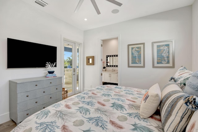 bedroom featuring visible vents, wood finished floors, recessed lighting, connected bathroom, and a sink