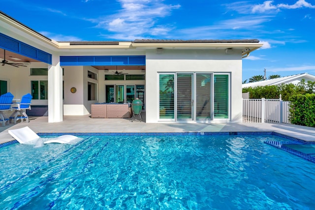 view of pool with a fenced in pool, a ceiling fan, and a patio area