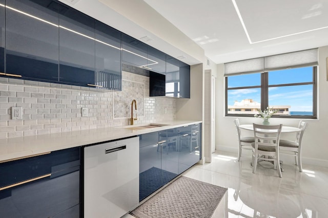 4600 S Ocean Blvd Unit 1003, Highland Beach, FL 33487 - kitchen featuring dishwasher, baseboards, tasteful backsplash, a sink, and light tile patterned flooring