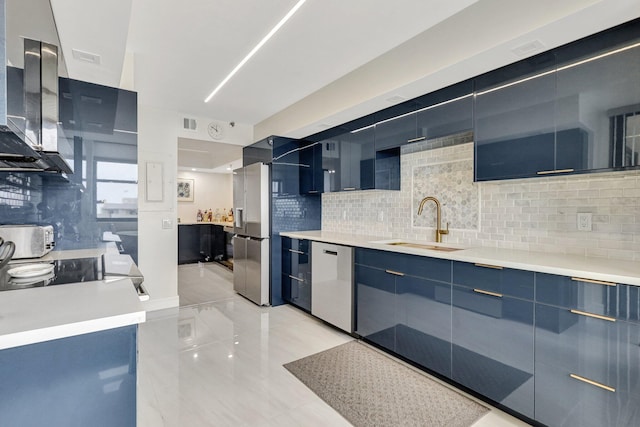 4600 S Ocean Blvd Unit 1003, Highland Beach, FL 33487 - kitchen featuring appliances with stainless steel finishes, ventilation hood, a sink, modern cabinets, and blue cabinetry