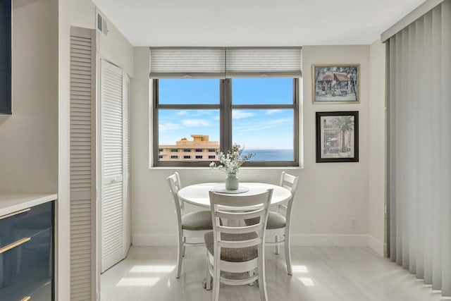 4600 S Ocean Blvd Unit 1003, Highland Beach, FL 33487 - dining area with baseboards