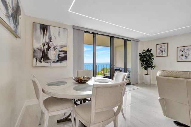 4600 S Ocean Blvd Unit 1003, Highland Beach, FL 33487 - dining room with a water view and baseboards