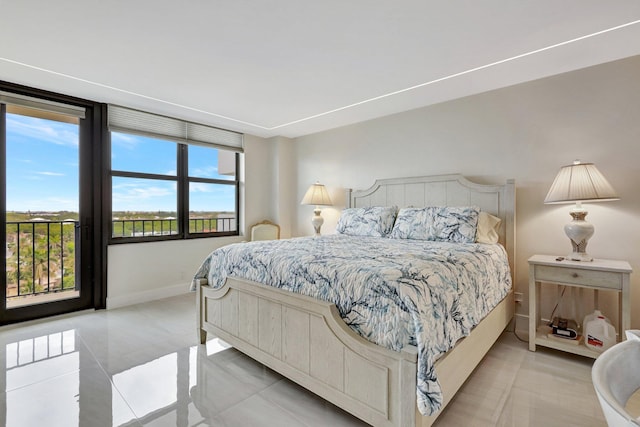 4600 S Ocean Blvd Unit 1003, Highland Beach, FL 33487 - bedroom featuring baseboards and light tile patterned floors