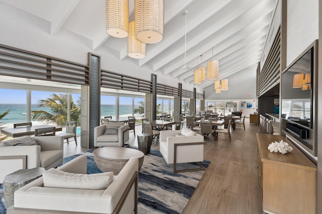 4600 S Ocean Blvd Unit 1003, Highland Beach, FL 33487 - living area featuring beamed ceiling, high vaulted ceiling, and wood finished floors