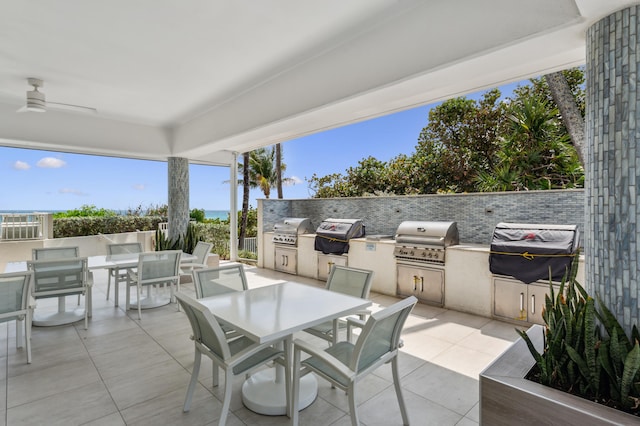 view of patio with outdoor dining area, a grill, and area for grilling