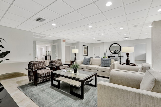 living area with recessed lighting, a paneled ceiling, and visible vents