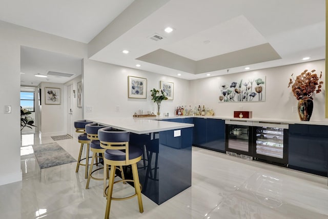 4600 S Ocean Blvd Unit 1003, Highland Beach, FL 33487 - indoor wet bar featuring wine cooler, recessed lighting, and a tray ceiling