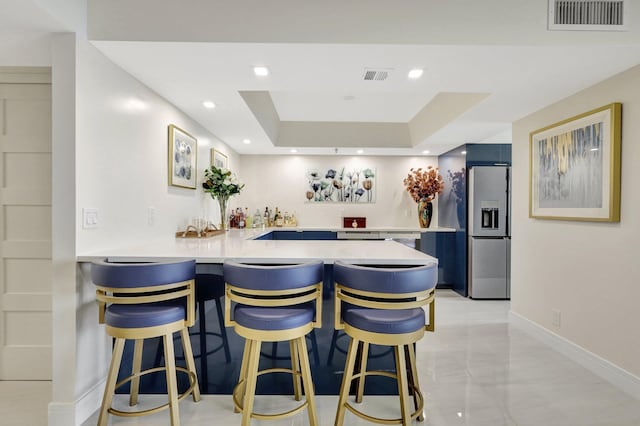 4600 S Ocean Blvd Unit 1003, Highland Beach, FL 33487 - indoor wet bar with stainless steel fridge with ice dispenser, baseboards, recessed lighting, and light marble finish flooring