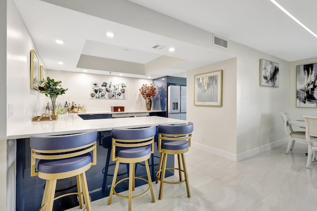 4600 S Ocean Blvd Unit 1003, Highland Beach, FL 33487 - indoor wet bar with stainless steel refrigerator with ice dispenser, baseboards, recessed lighting, and a raised ceiling