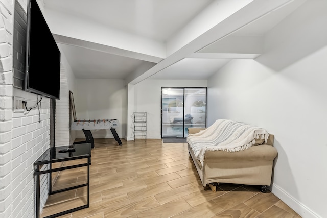 living area with light wood-style floors and baseboards