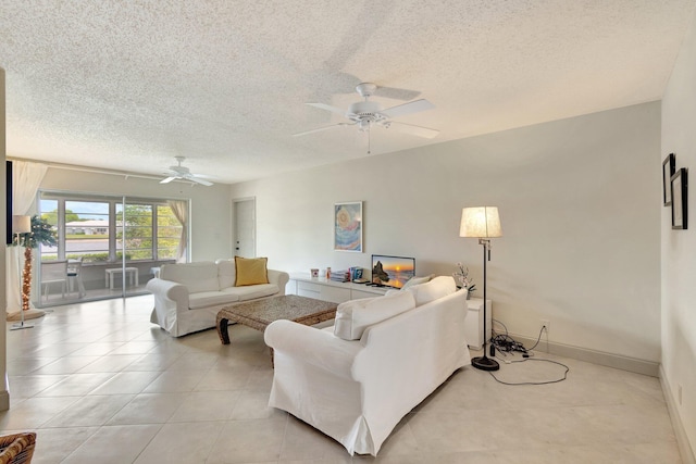 14612 Canalview Dr Unit B, Delray Beach, FL 33484 - living room featuring a ceiling fan, a textured ceiling, and light tile patterned floors
