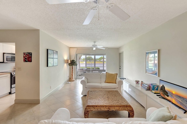14612 Canalview Dr Unit B, Delray Beach, FL 33484 - living room with a textured ceiling, ceiling fan, and light tile patterned floors