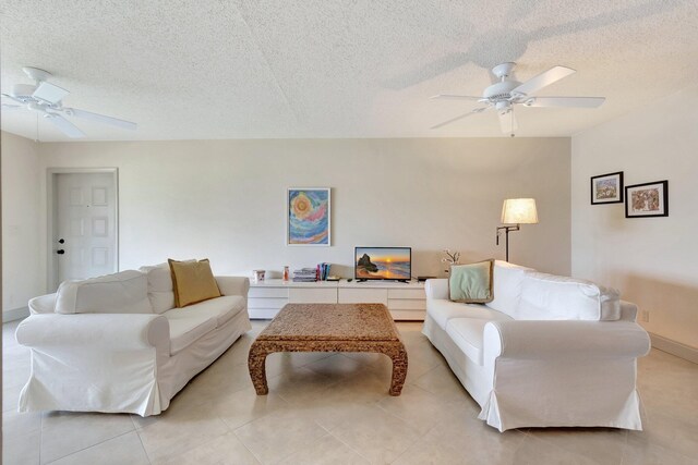 14612 Canalview Dr Unit B, Delray Beach, FL 33484 - living room featuring light tile patterned floors, a ceiling fan, and a textured ceiling