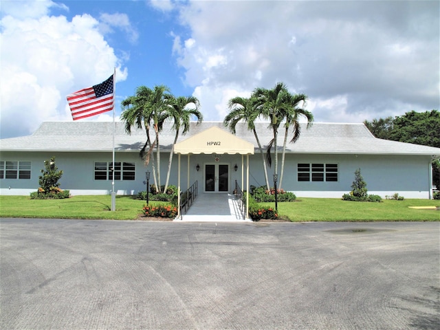 14612 Canalview Dr Unit B, Delray Beach, FL 33484 - ranch-style home featuring french doors, stucco siding, and a front lawn