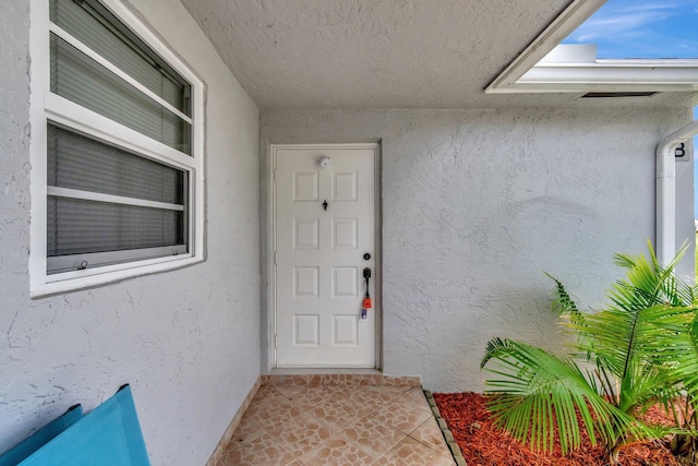 14612 Canalview Dr Unit B, Delray Beach, FL 33484 - view of exterior entry with stucco siding