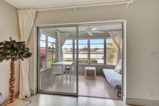 14612 Canalview Dr Unit B, Delray Beach, FL 33484 - entryway featuring a healthy amount of sunlight, a water view, ceiling fan, and light tile patterned flooring