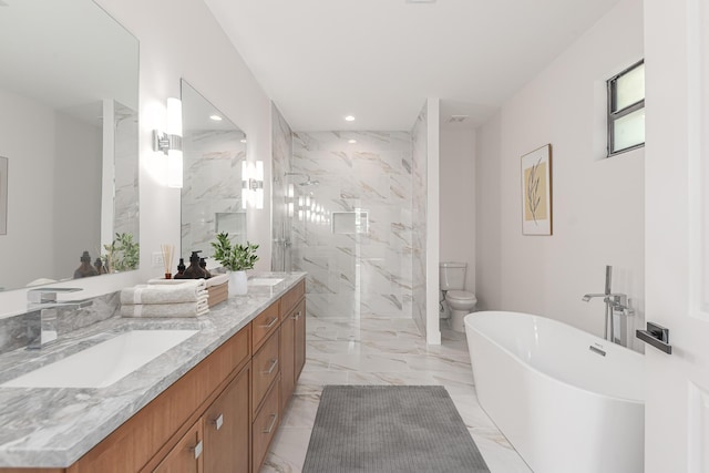 4657 SW Keats St, Port Saint Lucie, FL 34953 - full bath featuring marble tiled floors, recessed lighting, a marble finish shower, a freestanding tub, and double vanity